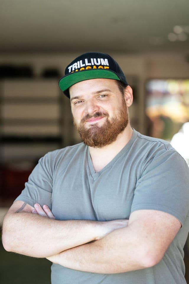 Trillium headshot with branded hat